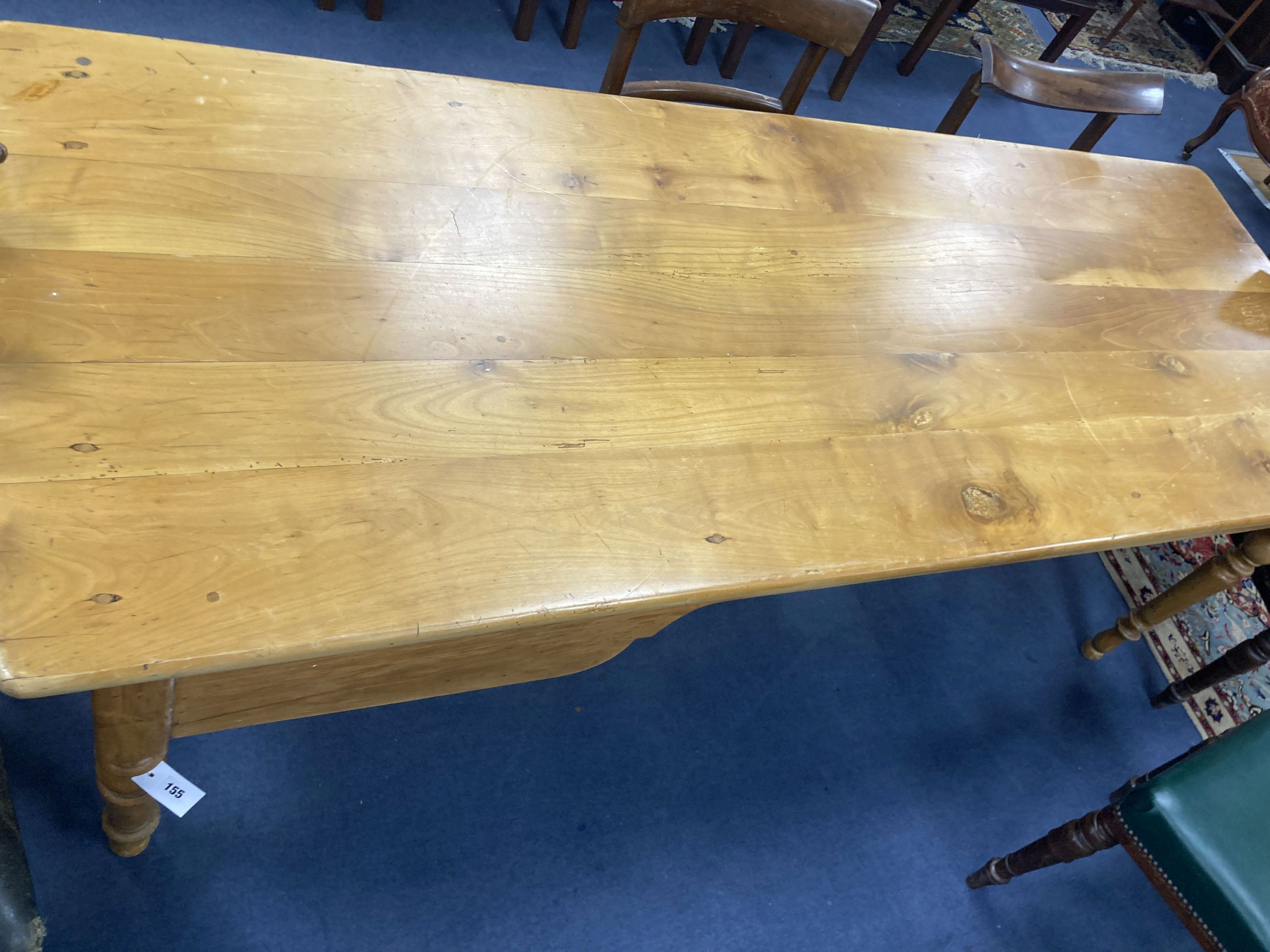 A 19th century French walnut farmhouse table, fitted with one deep and one shallow frieze drawer, length 208cm, depth 76cm, height 75cm